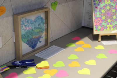 Paper of many different colours cut into the shape of hearts on a table