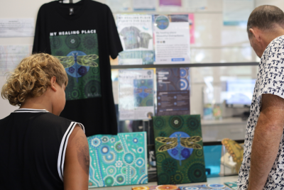 Two people looking at an art display