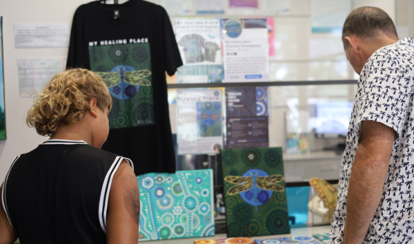Two people looking at an art display