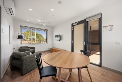 The inside of the Karratha Step Up/Step Down service building with a table and some chairs