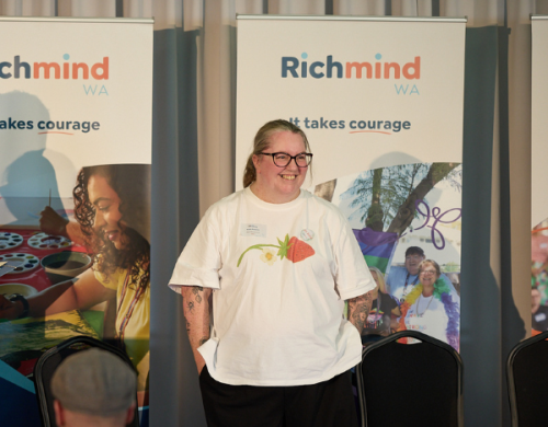 Katie Roberts speaking in front of an audience