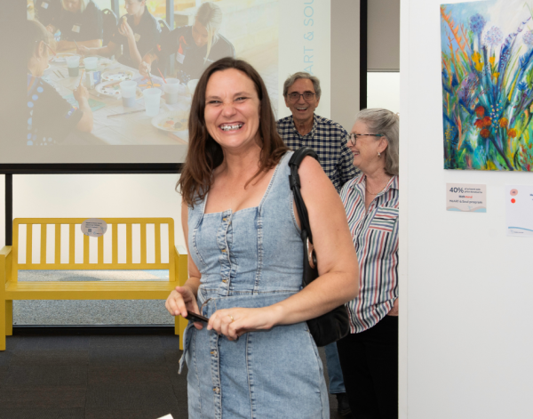 Woman smiling at art exhibition