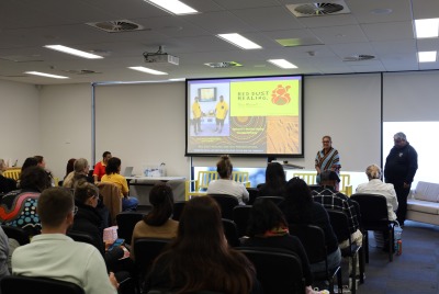 A Red Dust Training seminar being presented to an audience