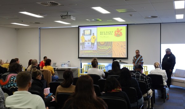 A Red Dust Training seminar being presented to an audience
